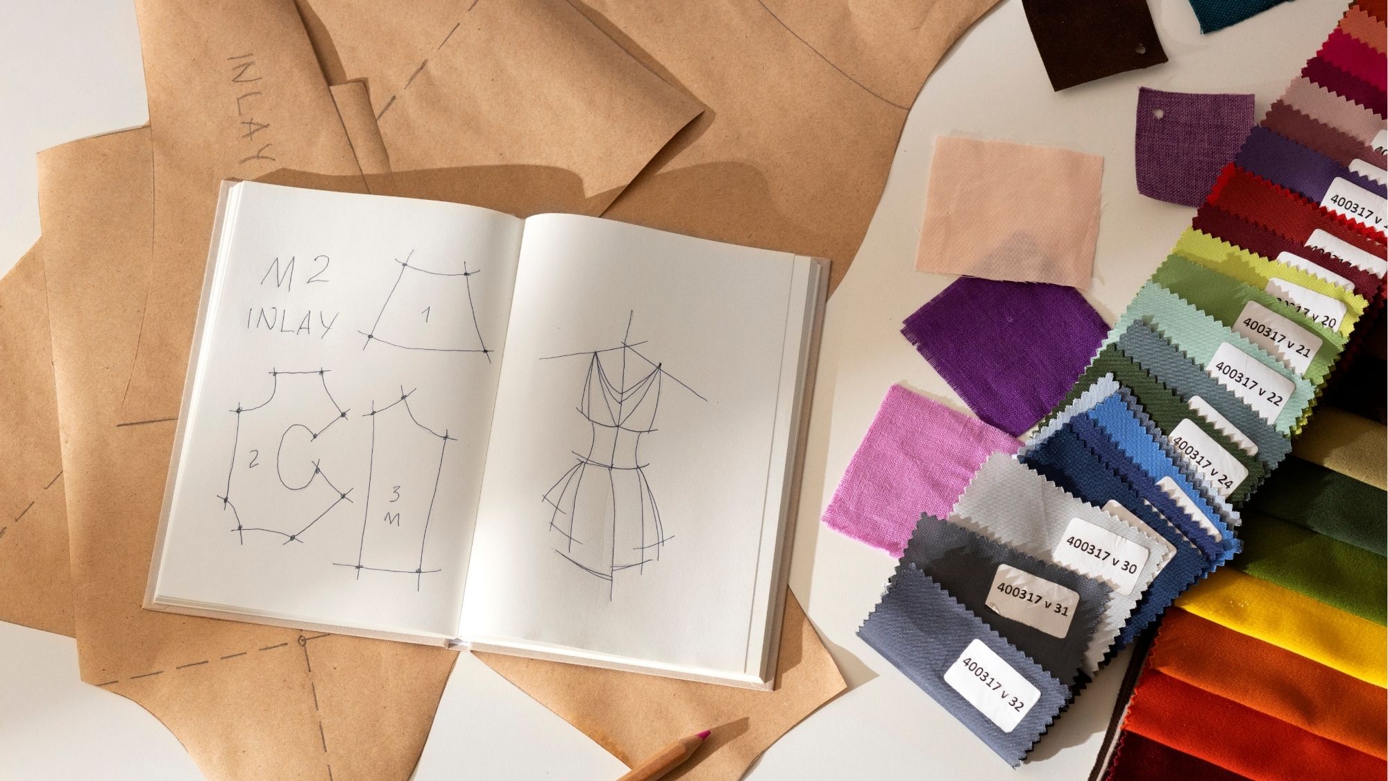 Fashion design sketches and fabric swatches